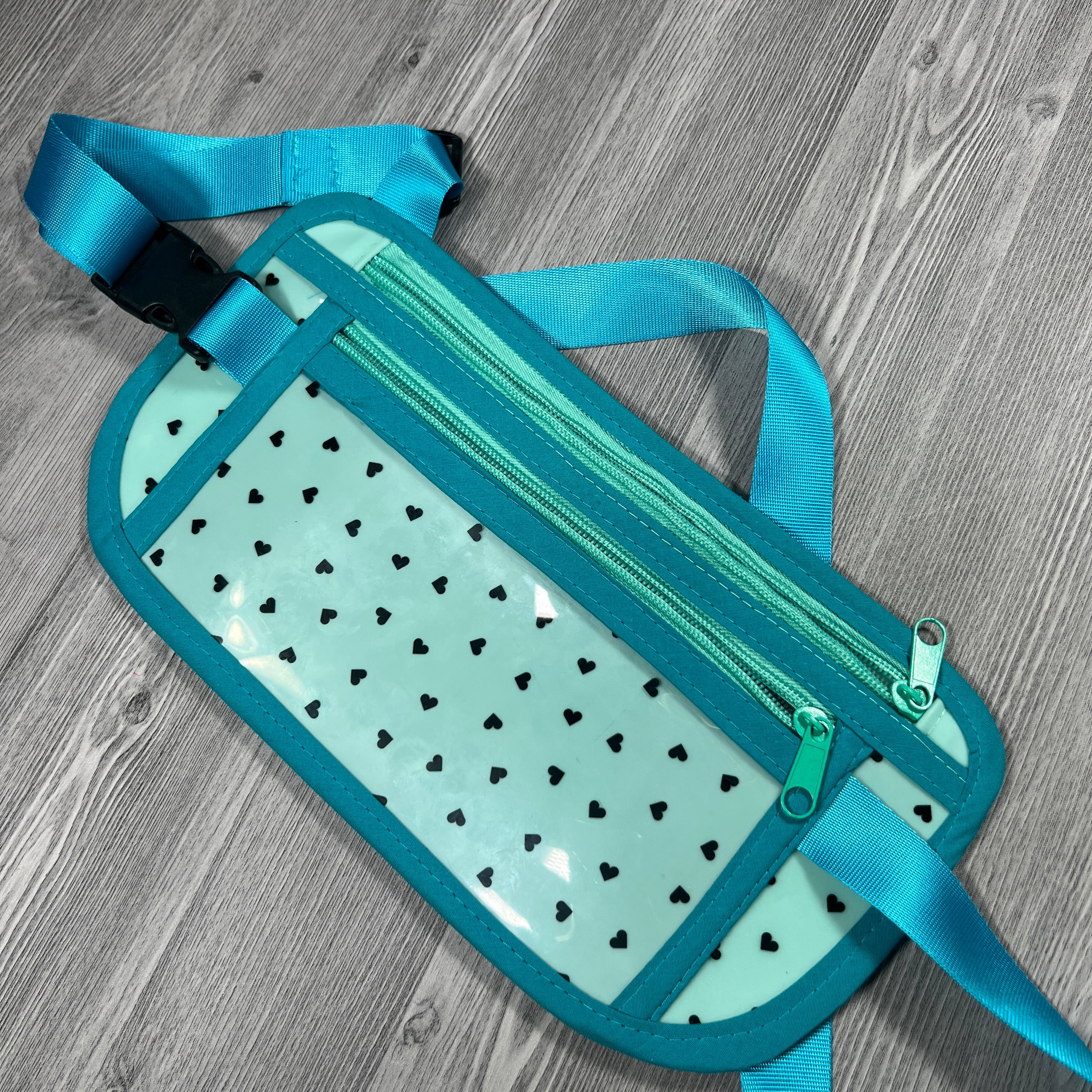 Turquoise jelly vinyl with black hearts travel belt