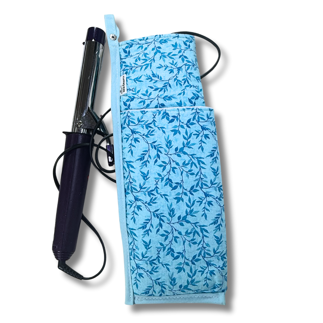 Blue floral-patterned hair straightener cover with a hair straightener on a white background