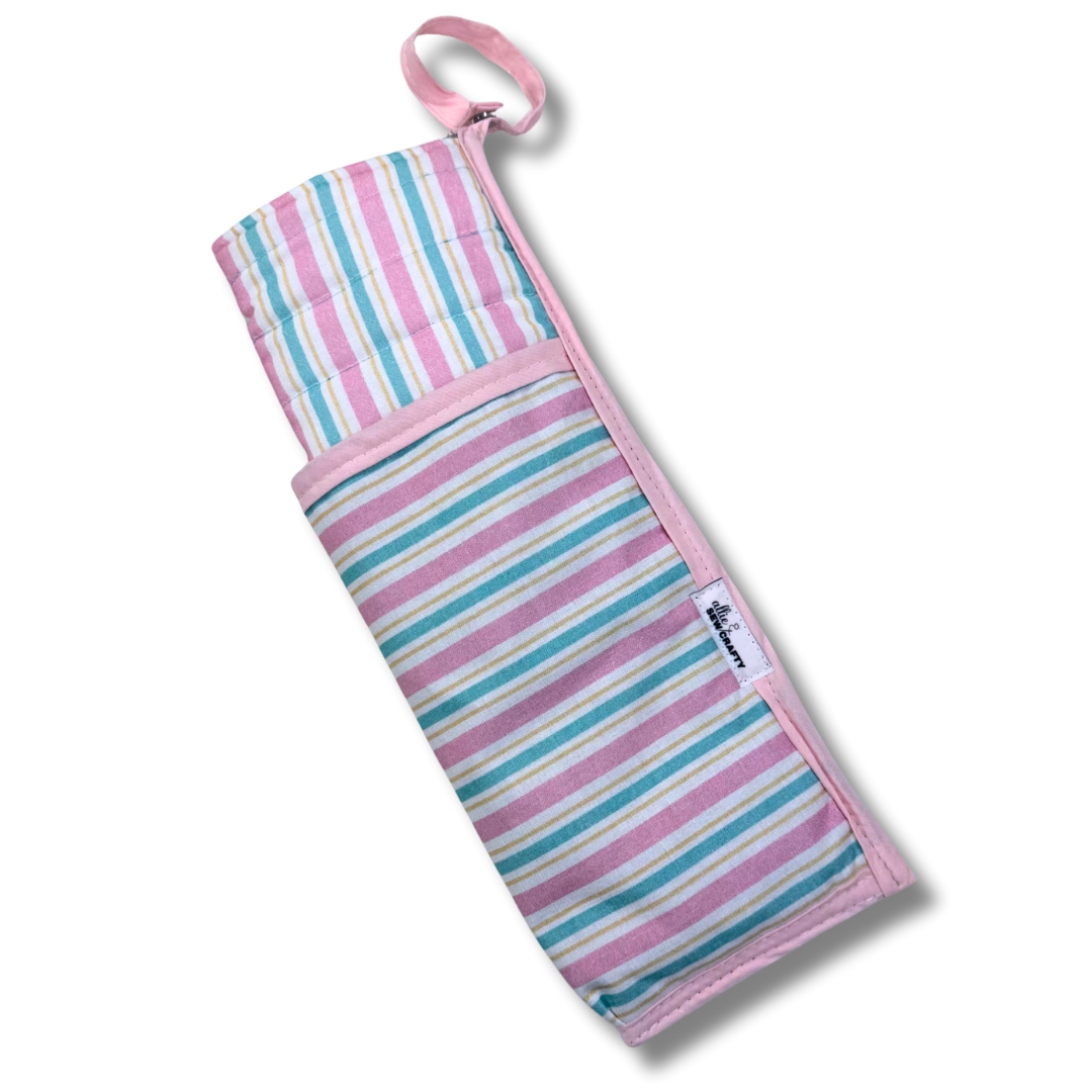 Striped fabric roll with pink handle on a white background