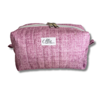 A mauve quilted fabric cosmetic pouch with a white brand label reading 'Allie Sew Crafty' on a white background.