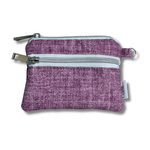 A small purple woven fabric zippered pouch with two silver metal zippers and a small white brand tag on the side, shown on a white background.