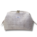 Textured beige pouch with a brand label on a white background