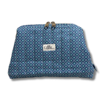 A zippered pouch with a blue and teal geometric pattern, featuring a white  plain white background with a white label that reads "Allie Sew Crafty"