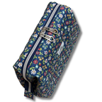 A navy blue zippered pouch with a colorful floral print, featuring two silver metal zipper pulls and a small white fabric brand label.