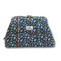 A quilted cosmetic pouch by Allie Sew Crafty featuring a navy blue background with a colorful floral pattern of pink, yellow, white, and green flowers, complete with a silver-tone metal clasp closure at the top.