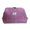 A textured purple cosmetic pouch with a white brand label reading '"Allie Sew Crafty' on a white background.