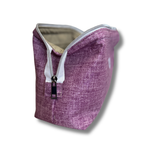 A textured purple zippered pouch with a beige interior lining, shown on a white background with a drop shadow.