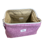 A rectangular zippered cosmetic bag in a heathered purple fabric, shown open to reveal a beige interior lining with a front pocket. A white brand label reading 'Allie.