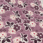 Close-up of the Purple Wildflower Bunch fabric print showing the dark floral pattern and quilted stitching detail