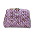A quilted cosmetic pouch in lavender purple with a repeating daisy pattern, featuring a small white brand label that reads 'Allie Sew Crafty'.